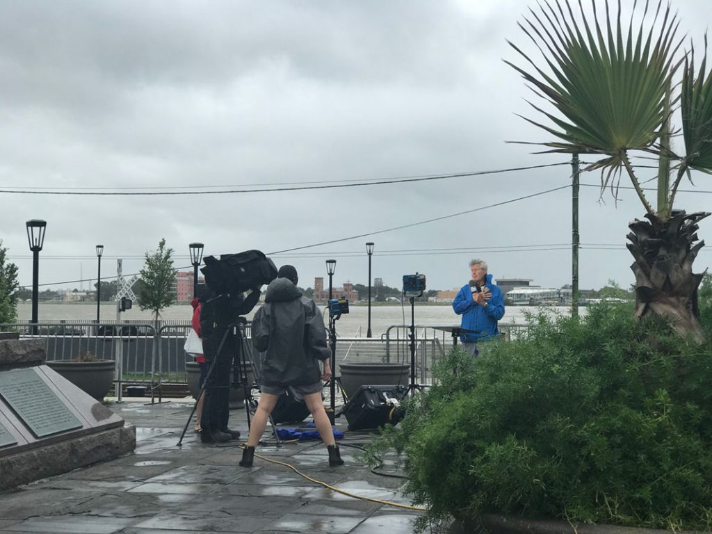 New Orleans before the storm has news reporters broadcasting from the French Quarter
