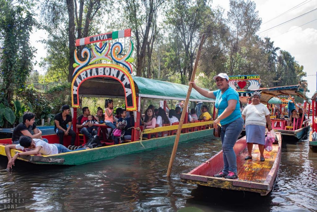 Each barge is filled with Mexican families, feasting and drinking.