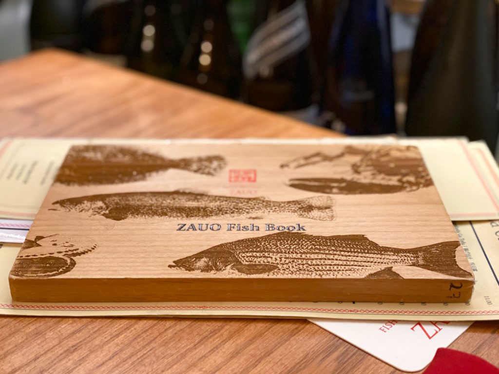 The menu of amazing fish and seafood is wooden at zauo chelsea new york
